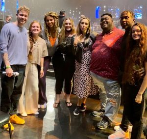 Adriana McPhee on set with singing contestants